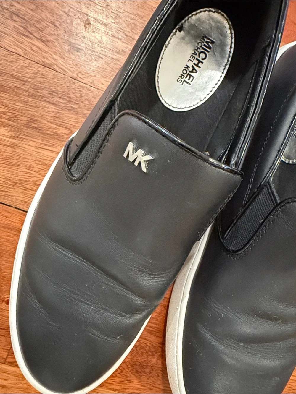 Michael Kors Black Leather Slip-On Sneakers with White Soles